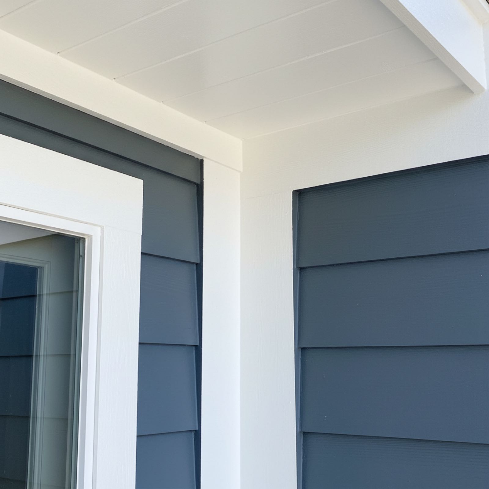 Exterior painting detail showing clean trim and fascia work